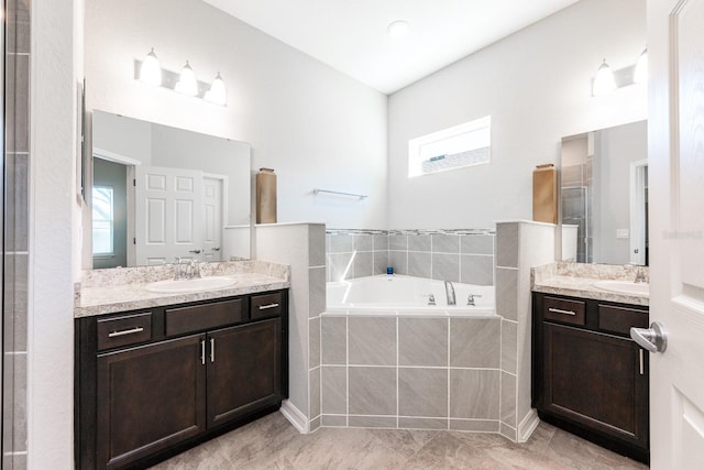 4231 Swan St, Haines City, FL 33844 - bathroom with a garden tub, two vanities, and a sink