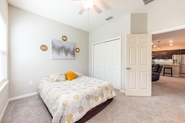 4231 Swan St, Haines City, FL 33844 - bedroom featuring stainless steel fridge with ice dispenser, a closet, visible vents, light carpet, and multiple windows