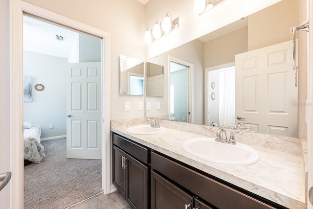 4231 Swan St, Haines City, FL 33844 - ensuite bathroom featuring a sink, visible vents, double vanity, and ensuite bathroom