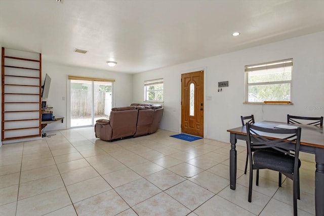 living area with recessed lighting, stairs, visible vents, and light tile patterned flooring