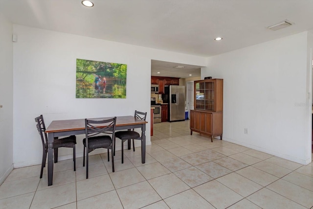 dining area featuring recessed lighting, light tile patterned floors, visible vents, and baseboards