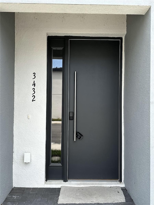3432 Tranquil Trl, Kissimmee, FL 34747 - property entrance with stucco siding