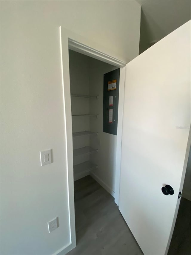 3432 Tranquil Trl, Kissimmee, FL 34747 - corridor with electric panel, baseboards, and wood finished floors