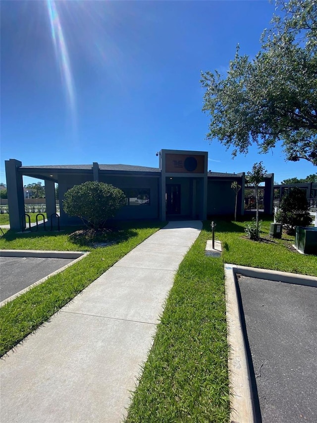 3432 Tranquil Trl, Kissimmee, FL 34747 - view of front of property with a front lawn