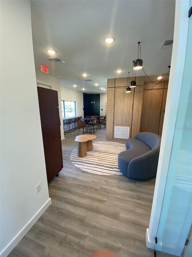 3432 Tranquil Trl, Kissimmee, FL 34747 - living room featuring baseboards, wood finished floors, and recessed lighting