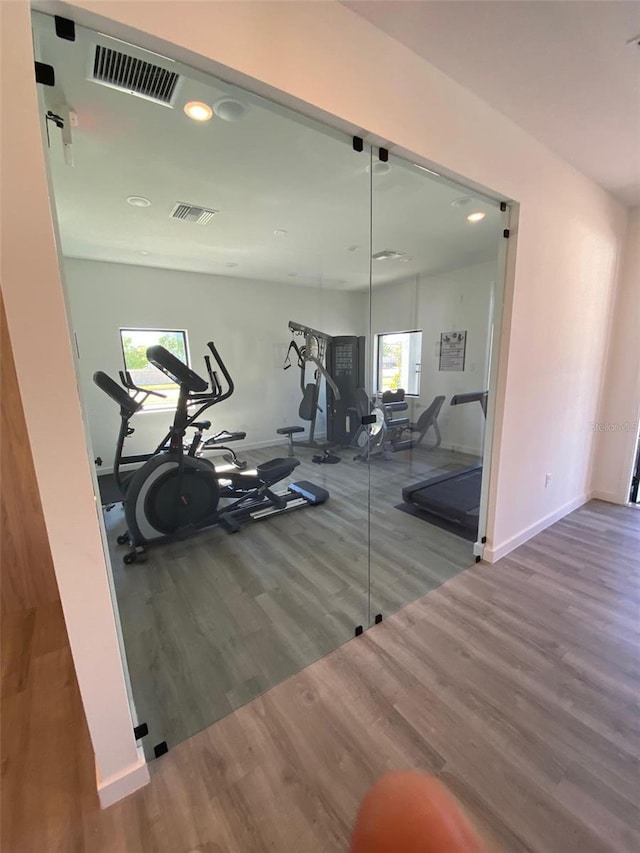 3432 Tranquil Trl, Kissimmee, FL 34747 - workout area featuring wood finished floors, baseboards, and recessed lighting