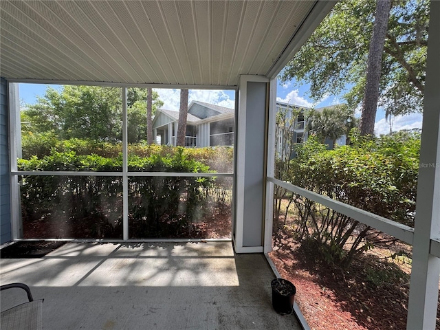 unfurnished sunroom featuring a healthy amount of sunlight