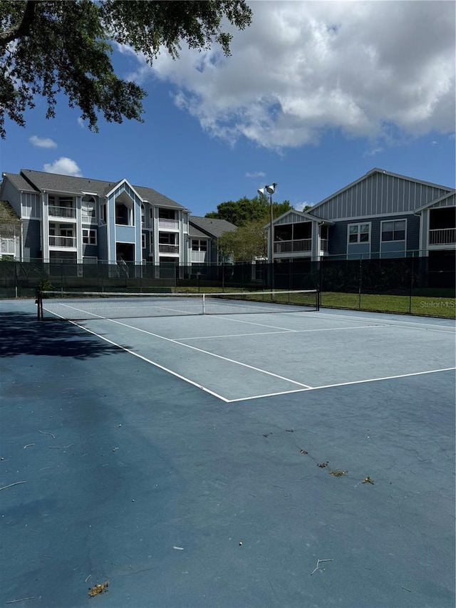 view of sport court with fence