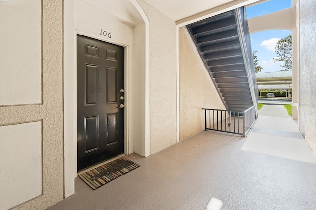 2484 San Tecla St Unit 106, Orlando, FL 32835 - view of exterior entry featuring stucco siding