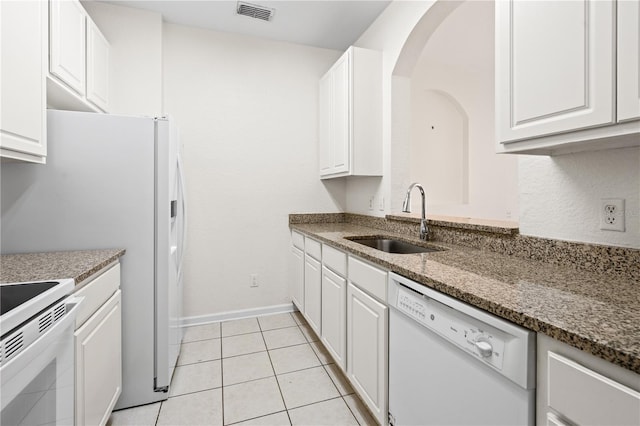 2484 San Tecla St Unit 106, Orlando, FL 32835 - kitchen featuring a sink, visible vents, white cabinets, and white appliances