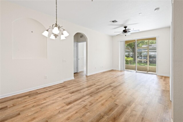 2484 San Tecla St Unit 106, Orlando, FL 32835 - interior space with arched walkways, visible vents, ceiling fan with notable chandelier, and light wood-style flooring