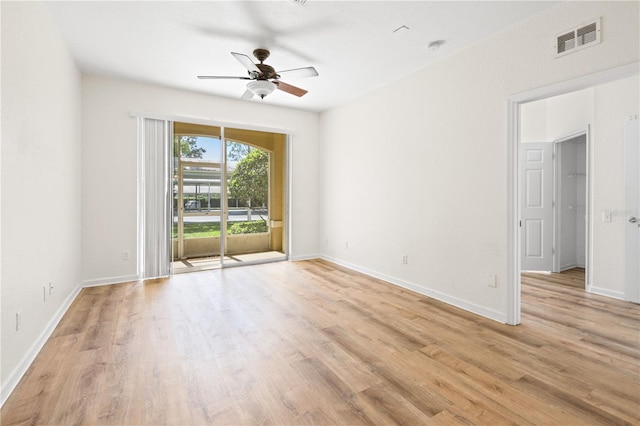 2484 San Tecla St Unit 106, Orlando, FL 32835 - spare room featuring visible vents, ceiling fan, light wood-style floors, and baseboards