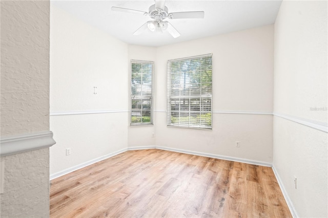 2484 San Tecla St Unit 106, Orlando, FL 32835 - unfurnished room with baseboards, a ceiling fan, and wood finished floors