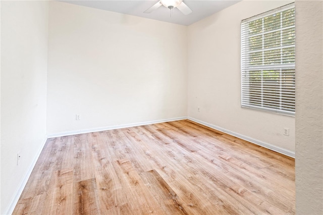 2484 San Tecla St Unit 106, Orlando, FL 32835 - empty room featuring wood finished floors, baseboards, and a ceiling fan