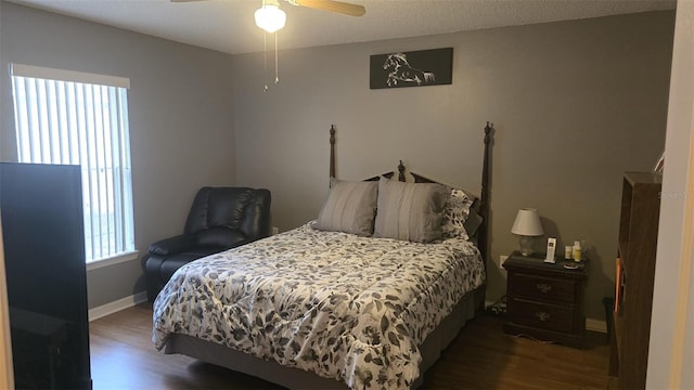 bedroom with baseboards, ceiling fan, and wood finished floors