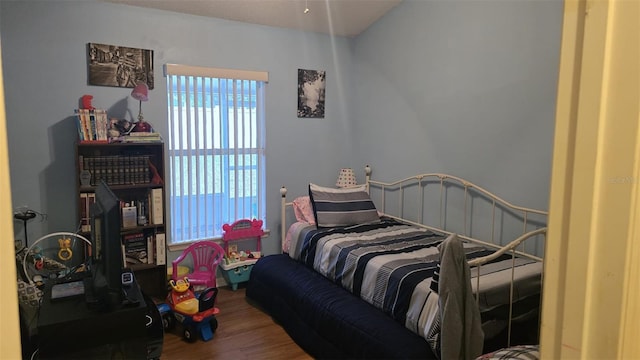 bedroom featuring wood finished floors