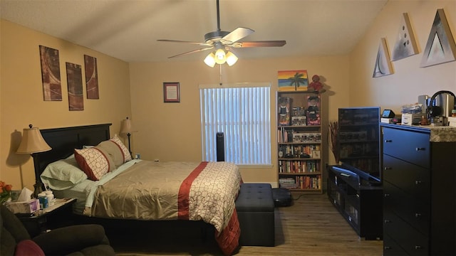 bedroom featuring a ceiling fan and wood finished floors