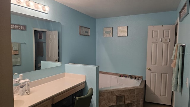 full bathroom with a bath and vanity