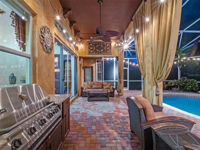 view of patio / terrace featuring ceiling fan, a lanai, area for grilling, and an outdoor hangout area