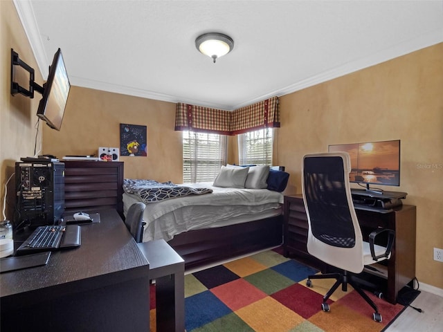 bedroom featuring ornamental molding and baseboards