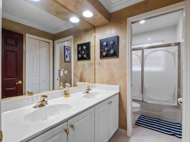 full bath with toilet, a sink, and ornamental molding
