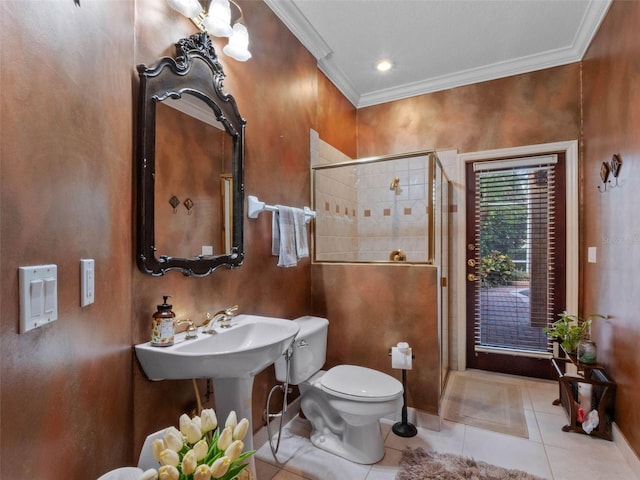 full bath with a shower stall, ornamental molding, toilet, a sink, and tile patterned floors