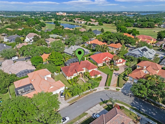 aerial view featuring a residential view and a water view
