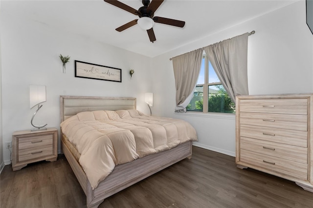 bedroom with baseboards, dark wood finished floors, and ceiling fan