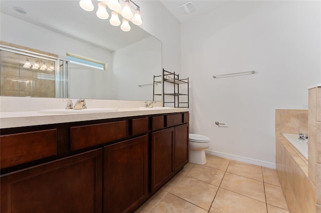 full bath featuring a stall shower, toilet, a sink, tile patterned flooring, and double vanity