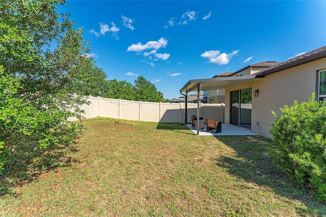 view of yard featuring a patio and fence