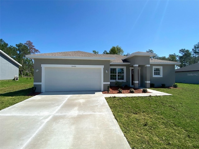 16435 SW 27th Ave, Ocala, FL 34473 - view of front of home with a garage, stucco siding, a front lawn, driveway, and roof with shingles