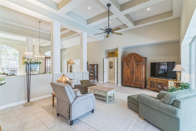 tiled living room with baseboards, coffered ceiling, ceiling fan with notable chandelier, beam ceiling, and a high ceiling