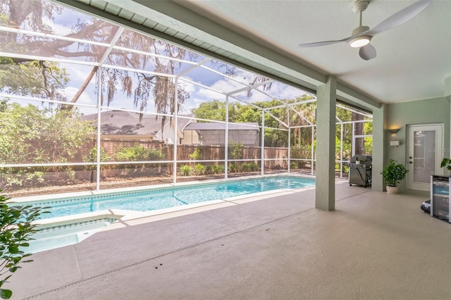 view of pool featuring a fenced backyard, area for grilling, an in ground hot tub, a patio area, and a lanai