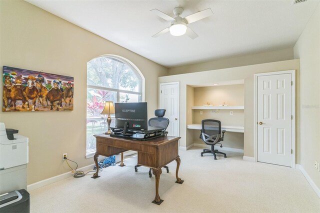 office area featuring a ceiling fan, carpet flooring, and baseboards