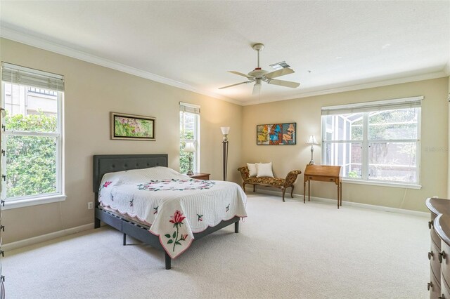 carpeted bedroom featuring crown molding, visible vents, multiple windows, and baseboards