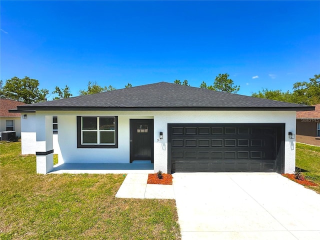 977 W Anderson Ln, Citrus Springs, FL 34434 - single story home with a garage, stucco siding, concrete driveway, a front yard, and central AC
