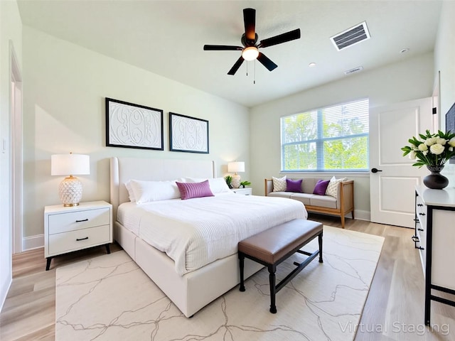977 W Anderson Ln, Citrus Springs, FL 34434 - bedroom with light wood finished floors, baseboards, and a ceiling fan