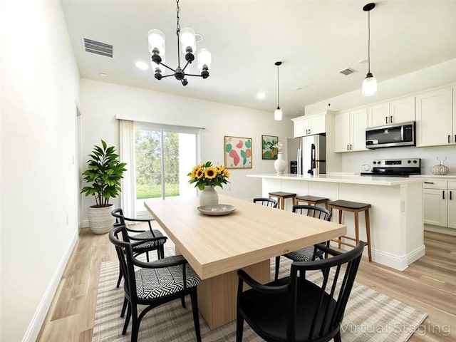 977 W Anderson Ln, Citrus Springs, FL 34434 - dining space with light wood-style floors, a chandelier, baseboards, and recessed lighting