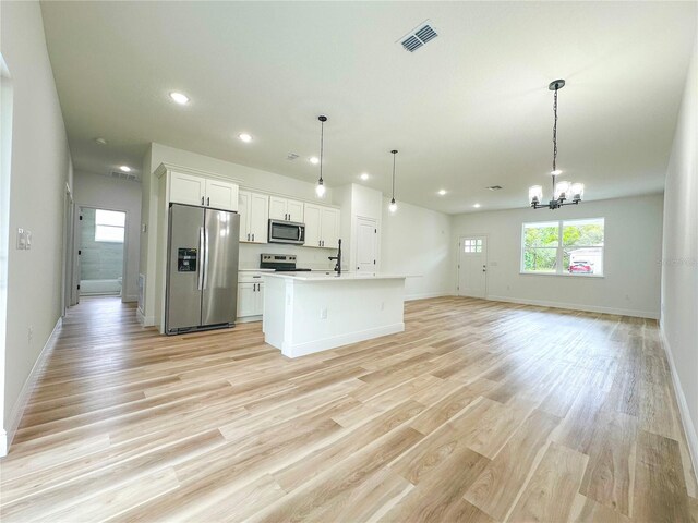 977 W Anderson Ln, Citrus Springs, FL 34434 - kitchen featuring appliances with stainless steel finishes, recessed lighting, white cabinets, open floor plan, and baseboards