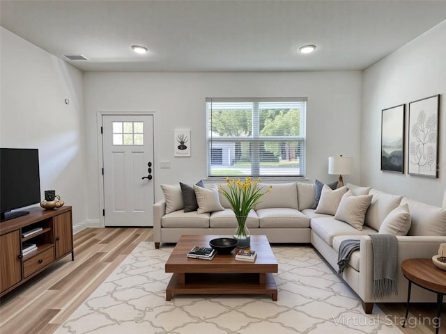 977 W Anderson Ln, Citrus Springs, FL 34434 - living room featuring light wood-style flooring, baseboards, and recessed lighting