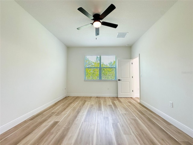 977 W Anderson Ln, Citrus Springs, FL 34434 - spare room with light wood-type flooring, ceiling fan, and baseboards
