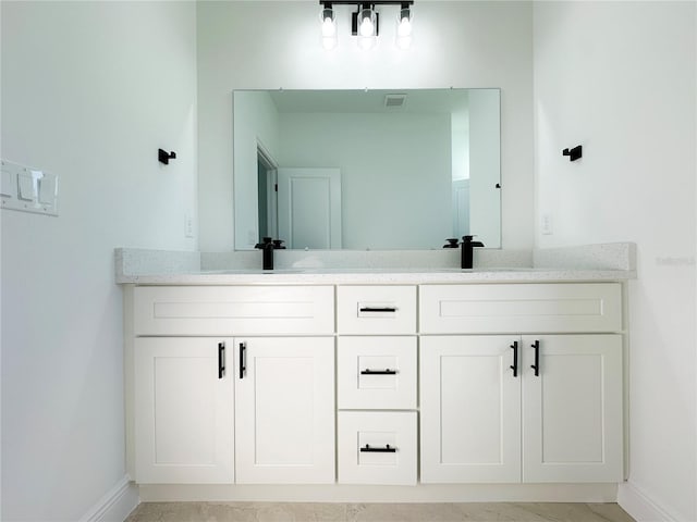 977 W Anderson Ln, Citrus Springs, FL 34434 - bathroom with baseboards and double vanity