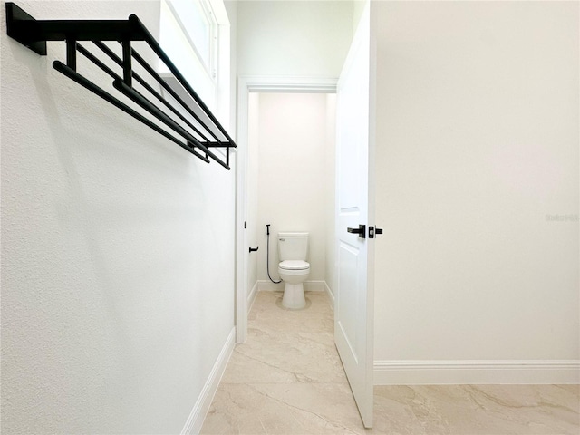 977 W Anderson Ln, Citrus Springs, FL 34434 - bathroom with toilet and baseboards