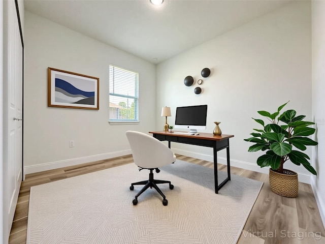 977 W Anderson Ln, Citrus Springs, FL 34434 - home office with baseboards and wood finished floors