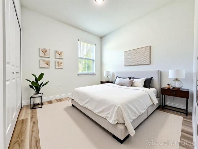 977 W Anderson Ln, Citrus Springs, FL 34434 - bedroom featuring light wood-style flooring and baseboards