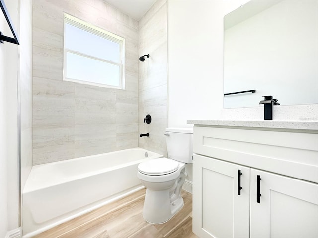 977 W Anderson Ln, Citrus Springs, FL 34434 - full bathroom with toilet, vanity, wood finished floors, bathing tub / shower combination, and baseboards