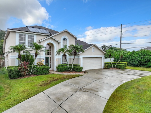 10915 Piping Rock Cir, Orlando, FL 32817 - view of front of property featuring stucco siding, an attached garage, and a front lawn
