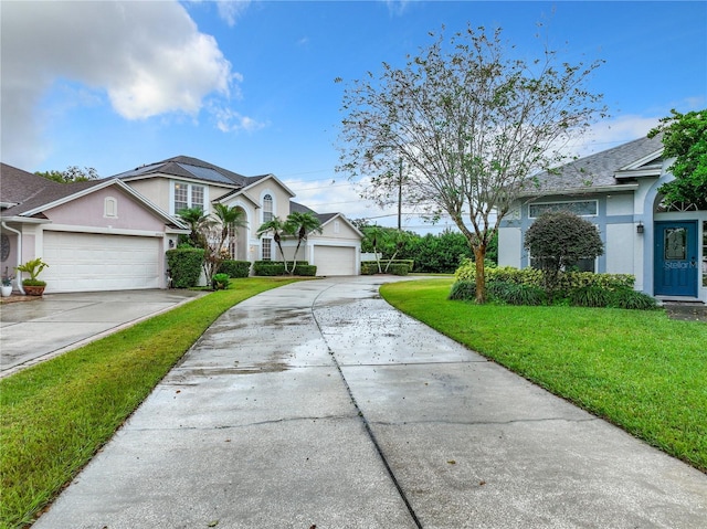 10915 Piping Rock Cir, Orlando, FL 32817 - view of front of property featuring a front yard, concrete driveway, and stucco siding