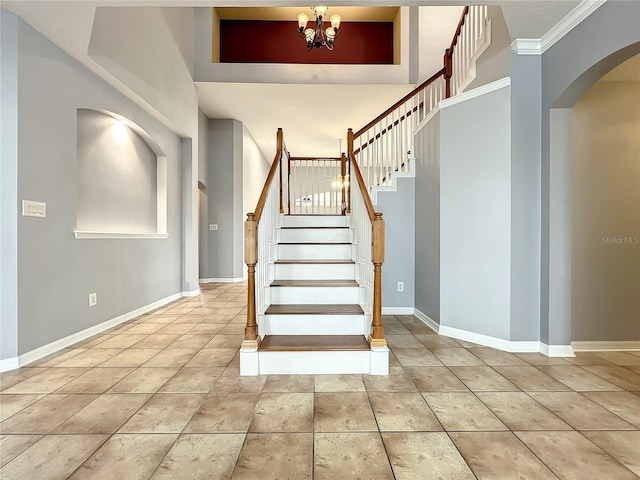 10915 Piping Rock Cir, Orlando, FL 32817 - stairs with baseboards, arched walkways, and an inviting chandelier