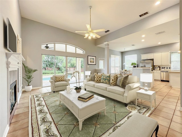 10915 Piping Rock Cir, Orlando, FL 32817 - living area with visible vents, ceiling fan, ornate columns, and light tile patterned floors